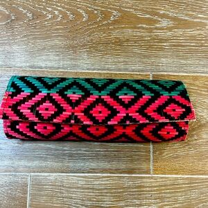 Raffia style clutch in green and red. Roomy, cute and fun!